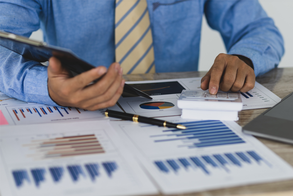 A close-up of a checklist being marked off, symbolizing the creation of a detailed financial plan.